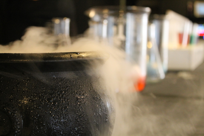 DRY ICE: To help differentiate a physical reaction from a chemical reaction, the Frost Science team creates a fun physical reaction by dropping dry ice into water, resulting in a spooky bubbling cauldron. The water molecules stay the same, but the physical form changes in a rather bewitching way.