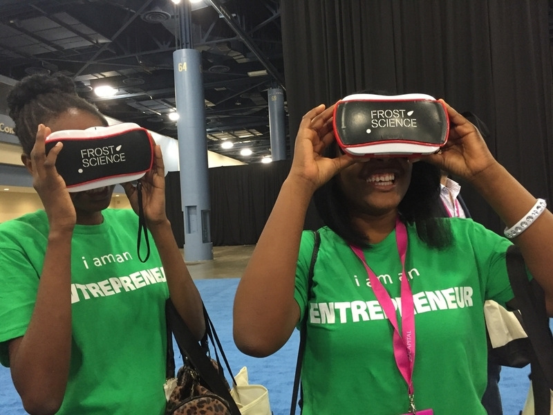 Two guests has on the Virtual reality headsets allowing them to travel through the layout of the new Frost Science museum.