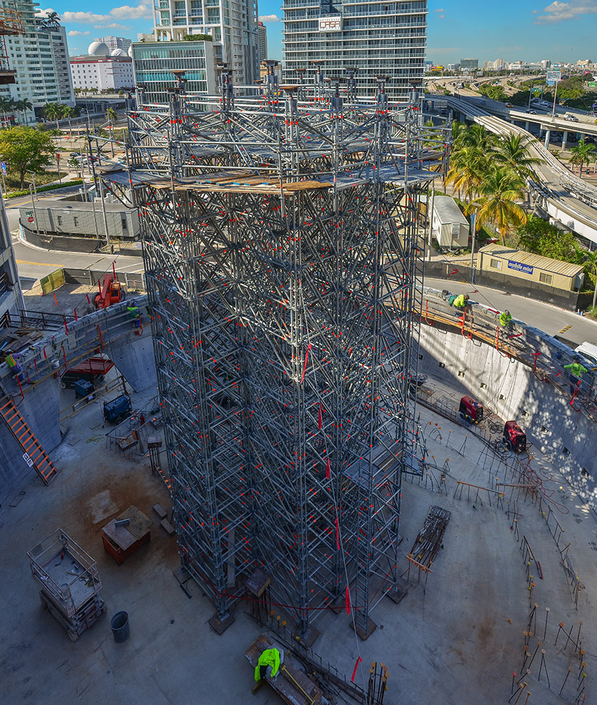 Scaffolding rises from the planetarium floor during construction.