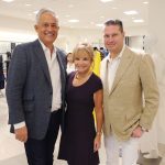 Group of adults posing for a photo at the Badgley Mischka Event