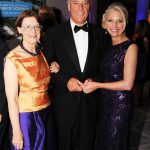 Adults posing for a photo at a gala