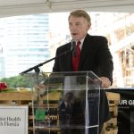 Man presenting during an event being held during the day