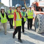 Woman guiding the tour of a construction site