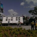 Equipment being brought in for a building that is under construction