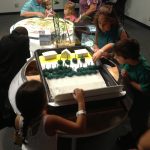 Visitors engaging in the exhibition.