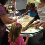 Visitors engaging in the exhibition.