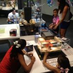 Visitors engaging in the exhibition.