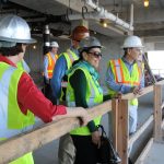 Group of adults at the construction site.