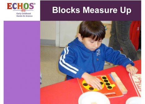 Young boy using book on blocks