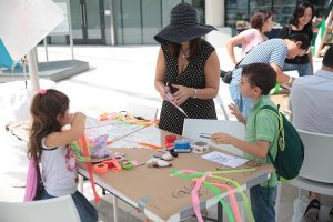 family-creating-kites-at-frost-science