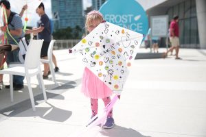 young-girl-showcasing-decorated-kite