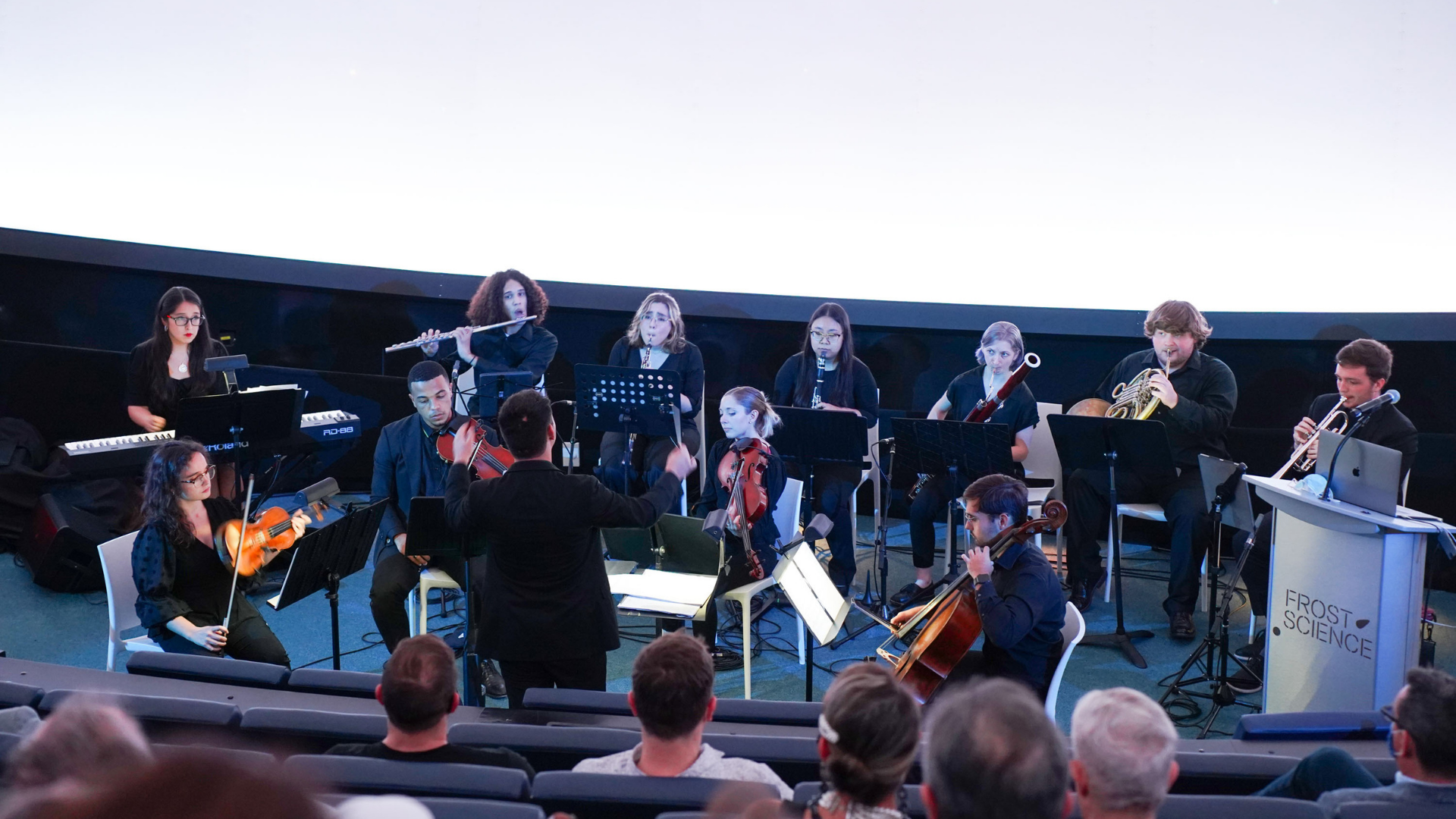 Performers inside the planetarium